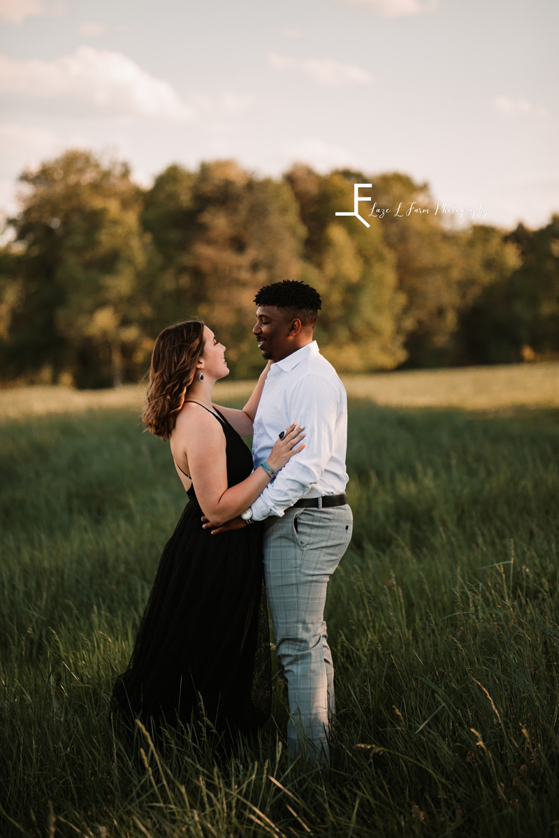 Laze L Farm Photography | Engagement Session | The Emerald Hill - Hiddenite NC | looking into each others eyes in the field
