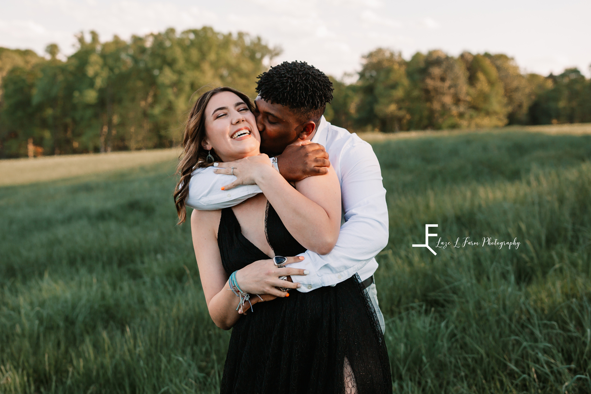 Laze L Farm Photography | Engagement Session | The Emerald Hill - Hiddenite NC | hugging from behind