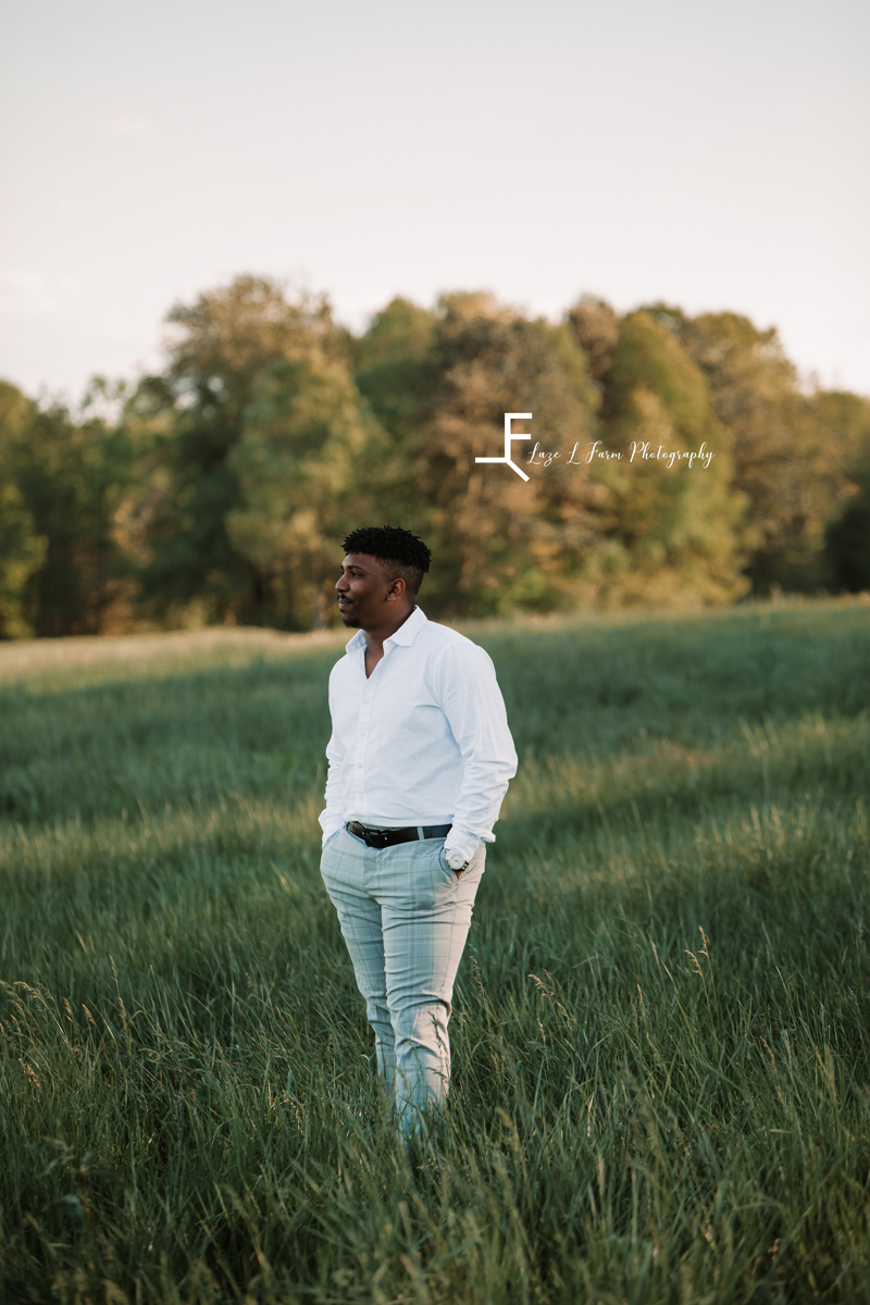 Laze L Farm Photography | Engagement Session | The Emerald Hill - Hiddenite NC | groom standing posed in the field