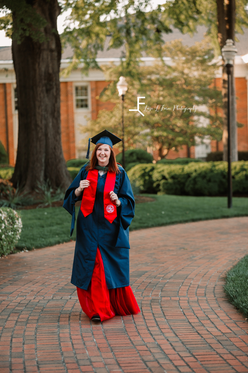 Laze L Farm Photography | Graduation Photoshoot | Statesville NC | walking down the street in graduation gown