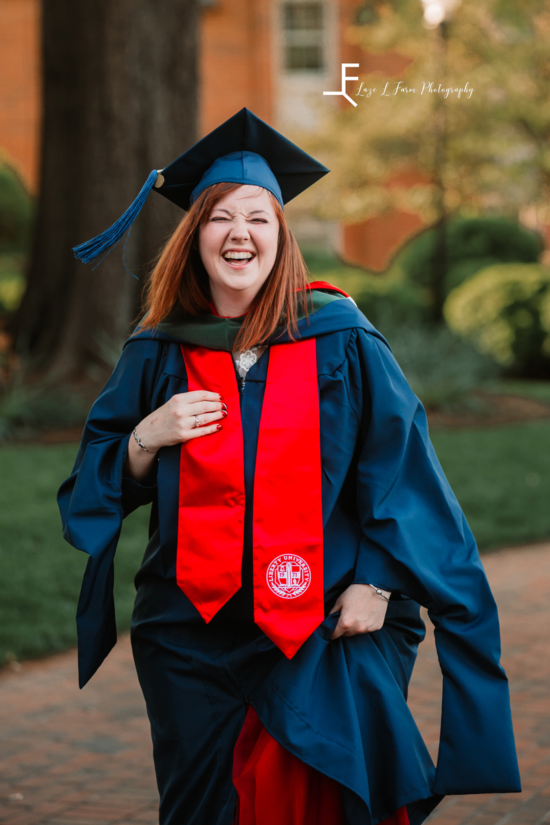 Laze L Farm Photography | Graduation Photoshoot | Statesville NC | candid laughing dressed in grad gown