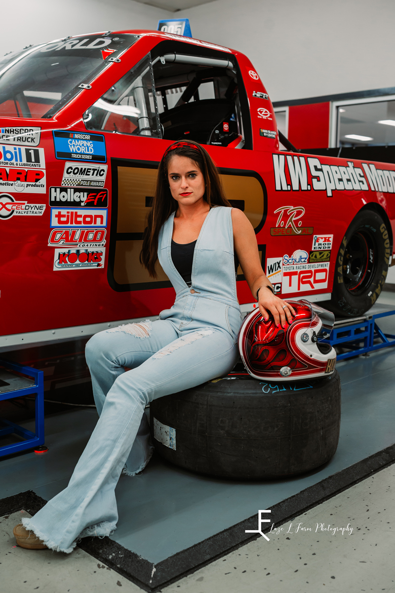 Laze L Farm Photography | NASCAR Photoshoot | Statesville NC | sitting next to the red racecar on a tire