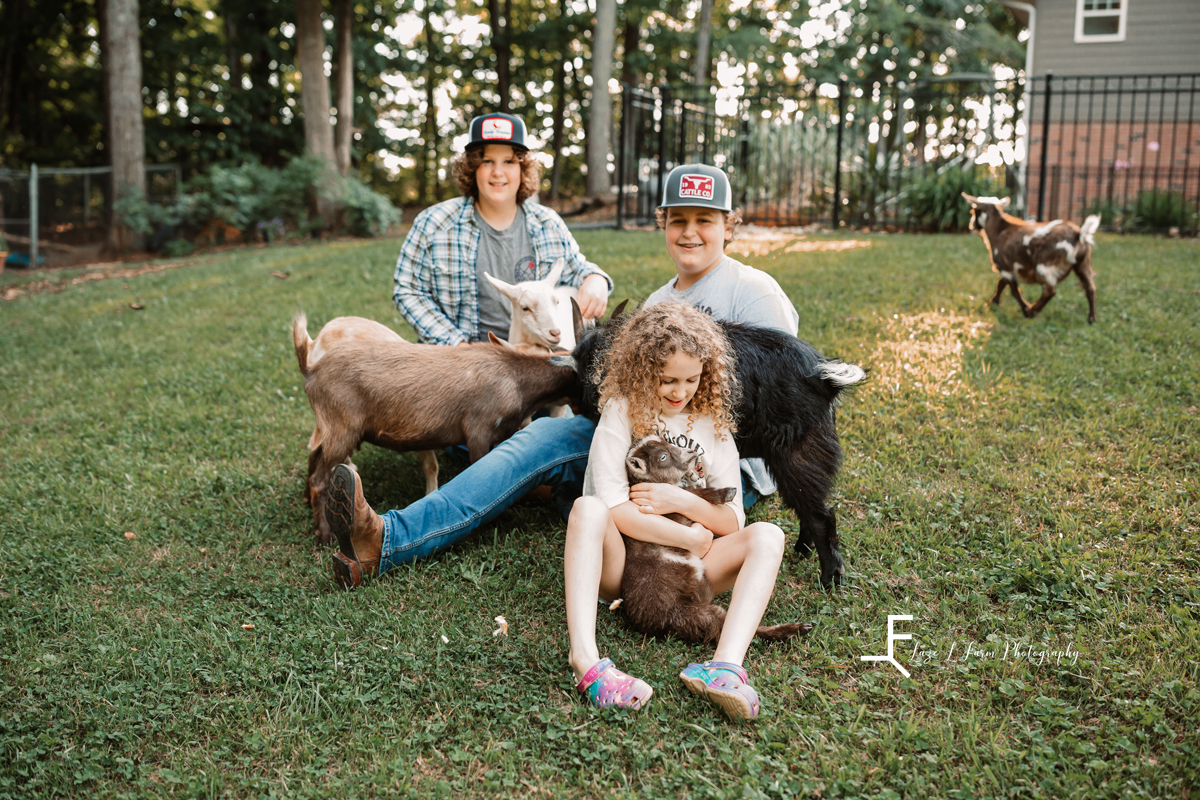 Laze L Farm Photography | Farm Session | Lincolnton NC | kids posing holding goats