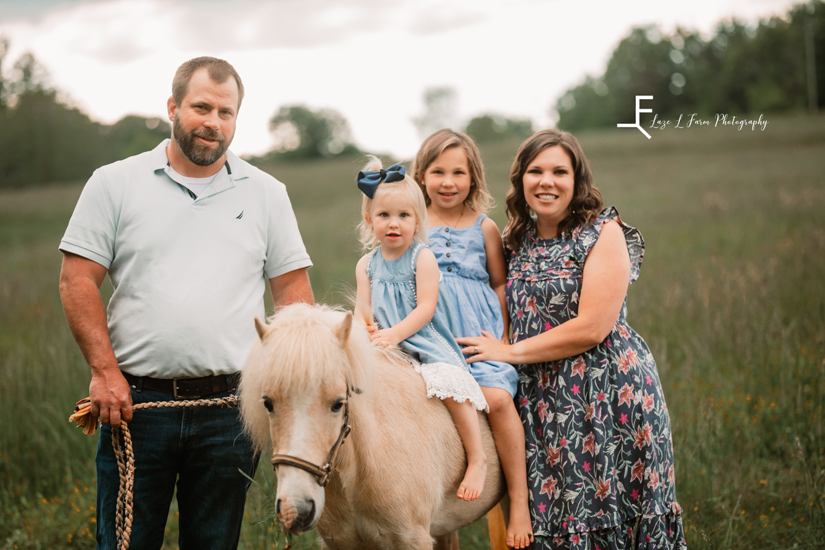 Laze L Farm Photography | Family Photographer | Taylorsville NC | daughters sitting on pony next to parents