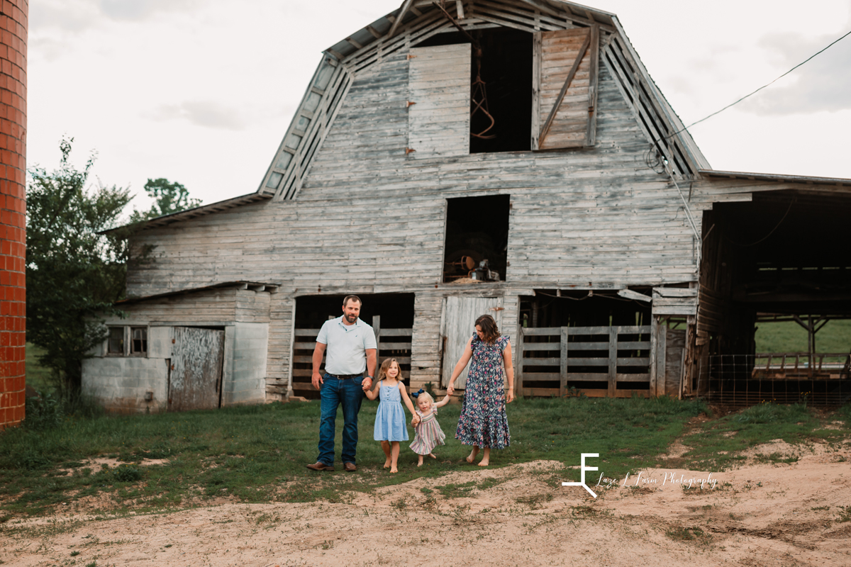 Laze L Farm Photography | Family Photographer | Taylorsville NC | family posing in front of barn