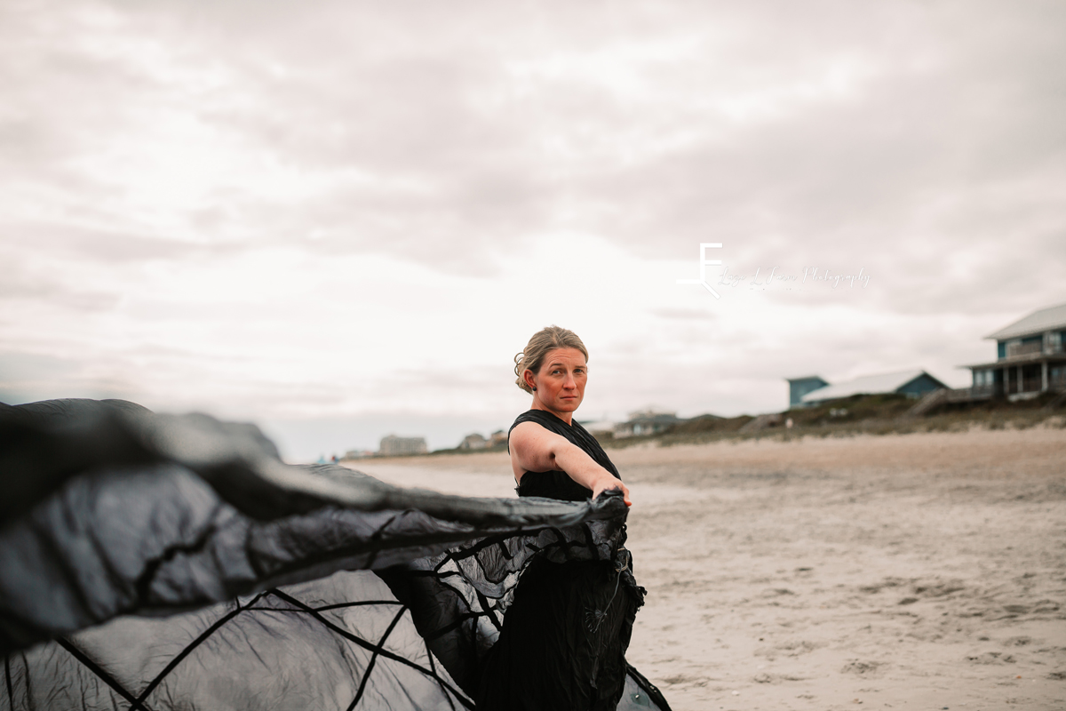 Laze L Farm Photography | Parachute Dress | Emerald Isle NC | throwing the dress in front of the camera