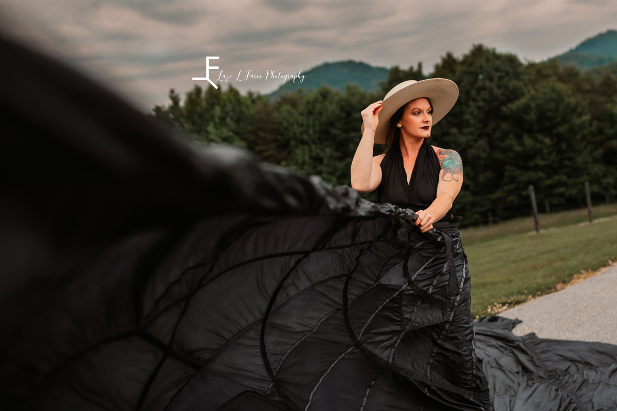 Laze L Farm Photography | Parachute Dress | Taylor Made Farms - Taylorsville NC | posing a hat while twirling the parachute dress
