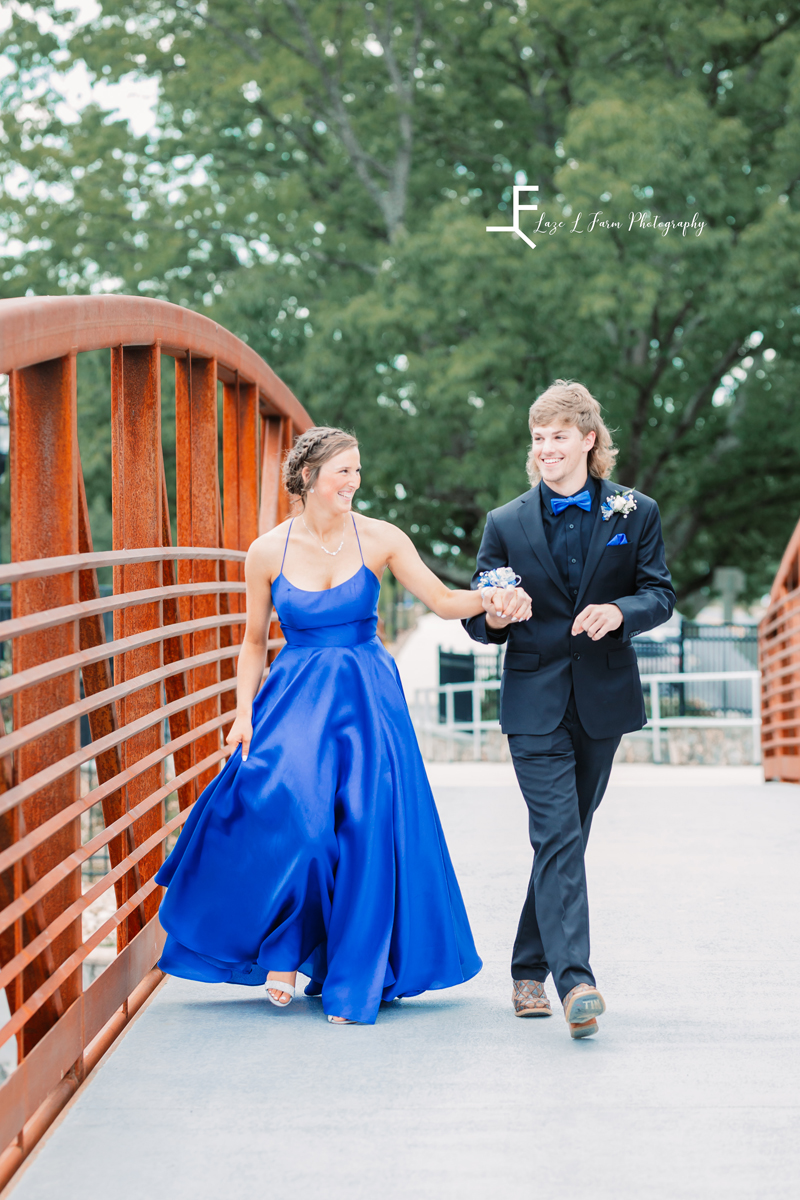  Laze L Farm Photography | Prom 2021 | Hickory NC |  couple walking on a bridge in prom dress