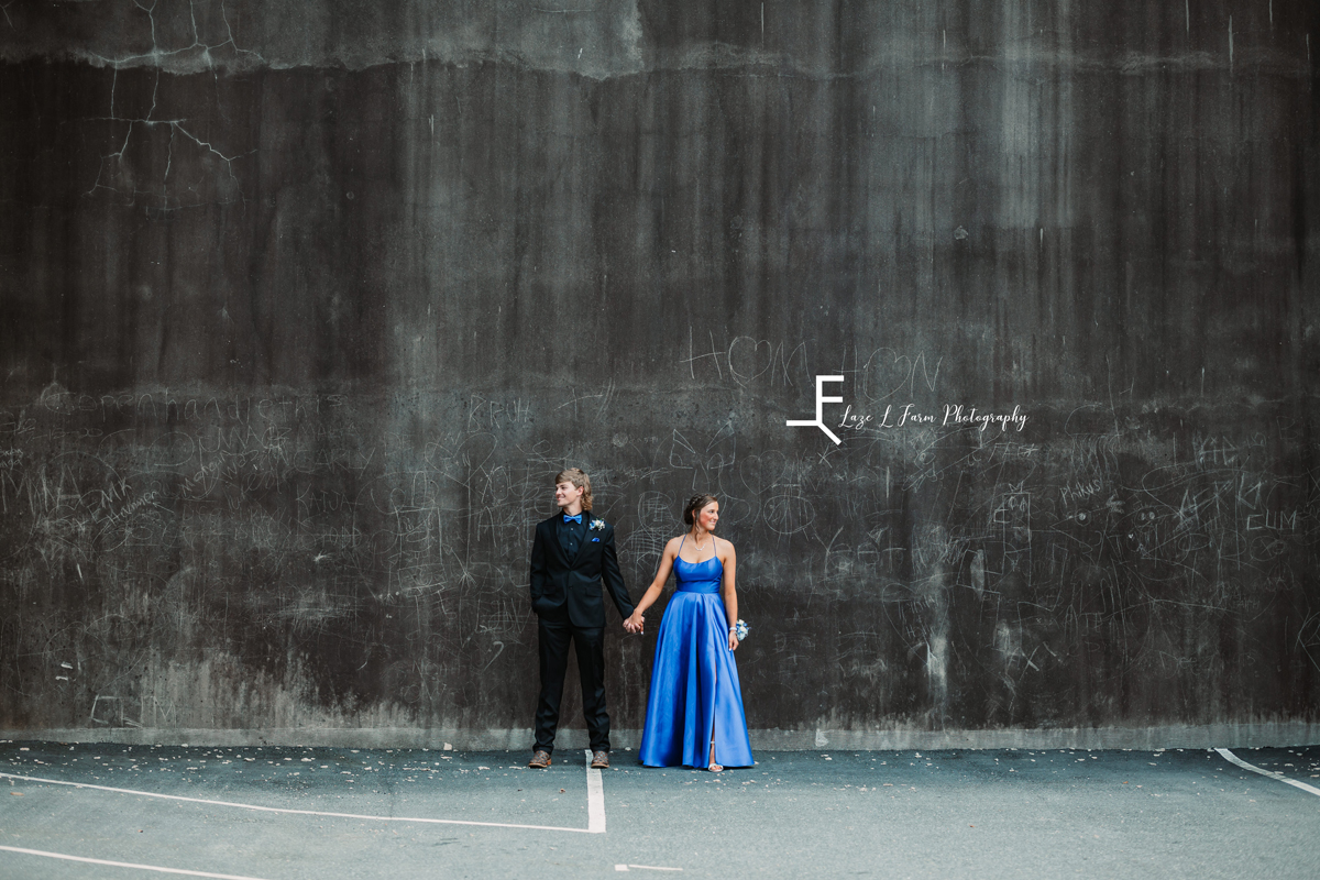  Laze L Farm Photography | Prom 2021 | Hickory NC |  couple posed in front of a wall