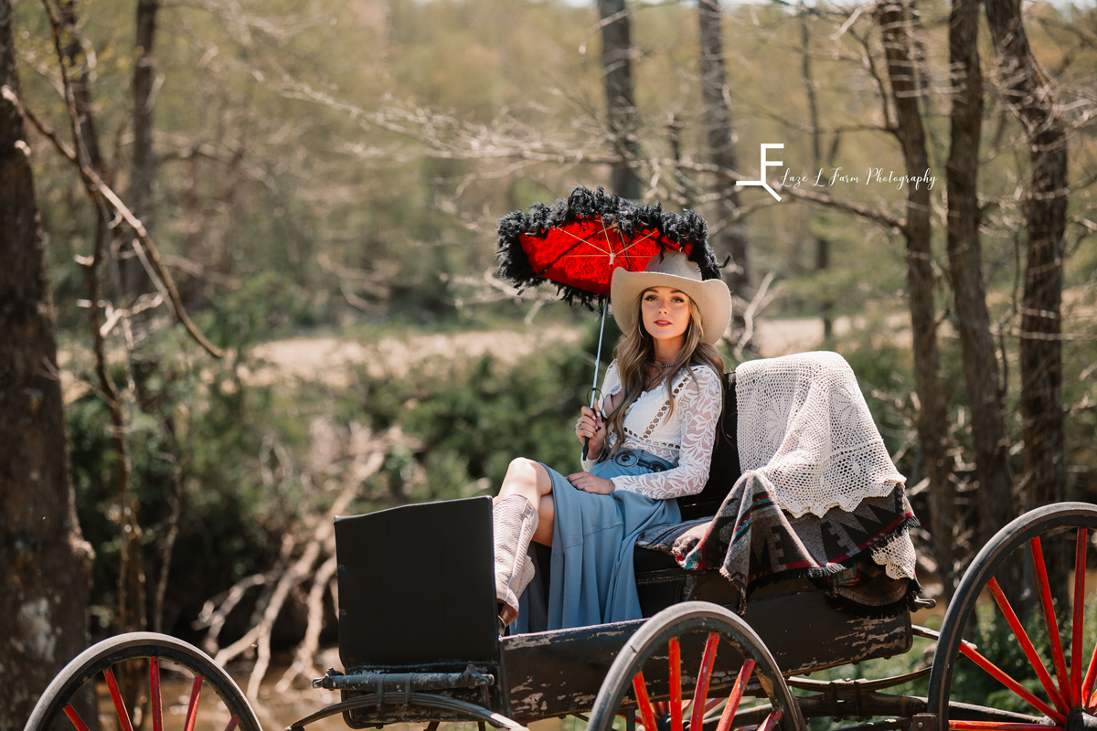 Laze L Farm Photography | Western Lifestyle Photoshoot | Wytheville Va | posing in a carriage holding umbrella