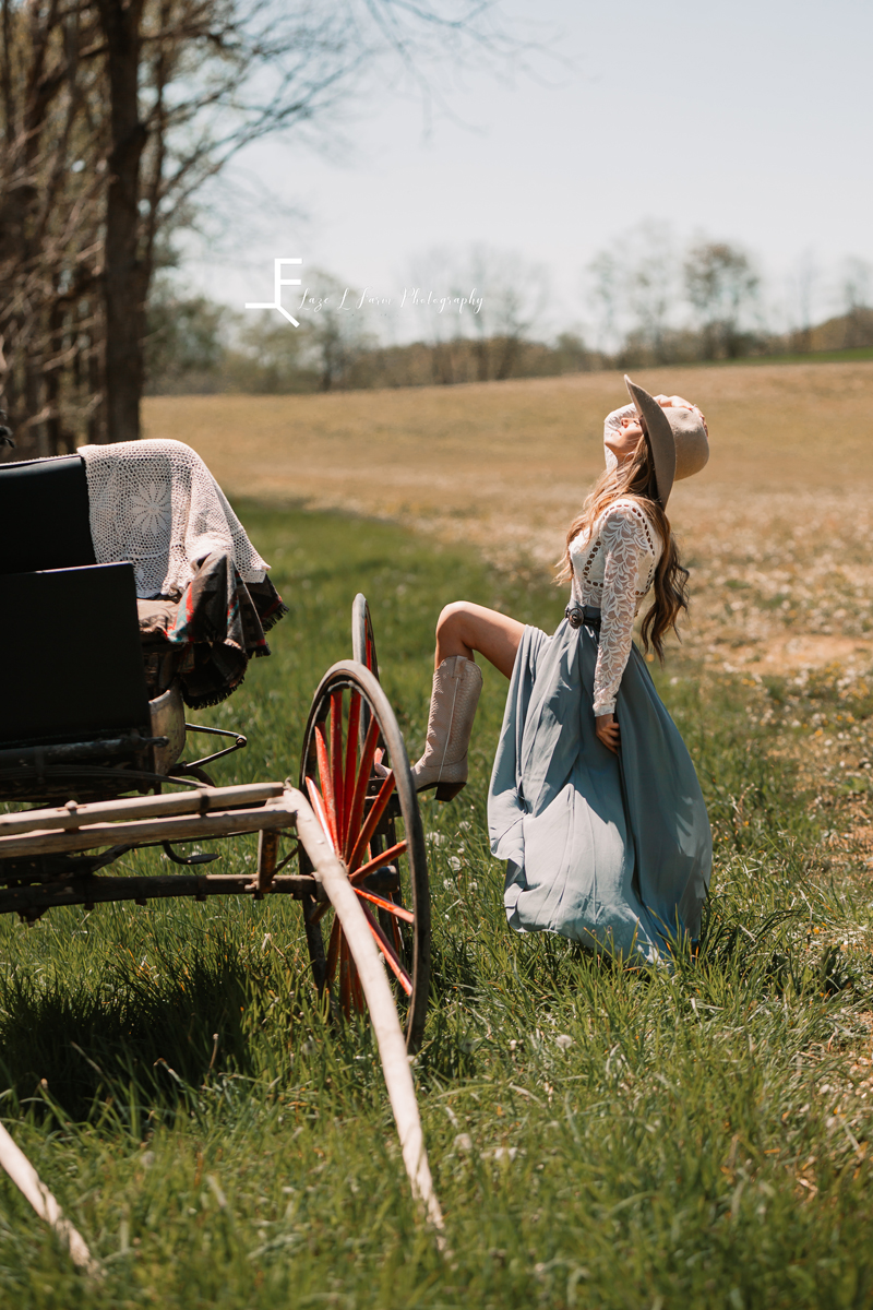 Laze L Farm Photography | Western Lifestyle Photoshoot | Wytheville Va | posing next to carriage