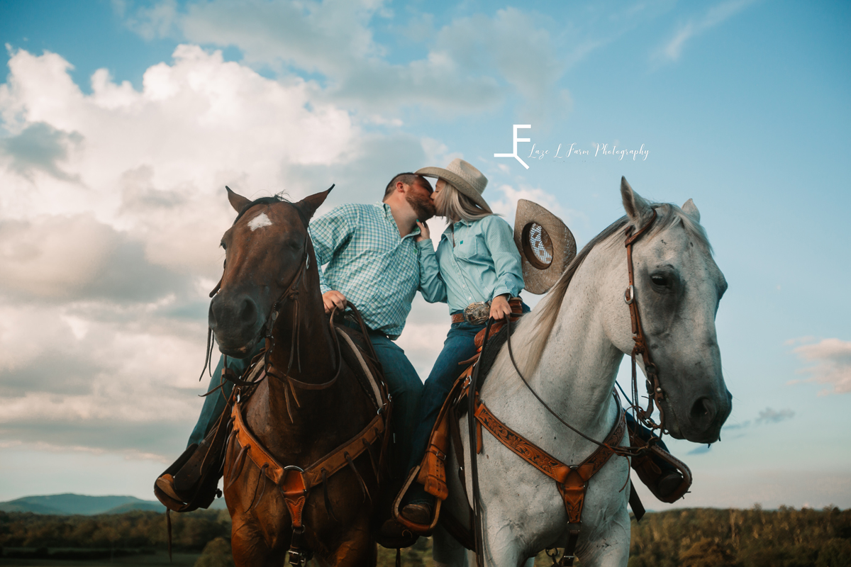 Laze L Farm Photography | Cowboy Couple | Taylorsville NC | couple kissing while on horses