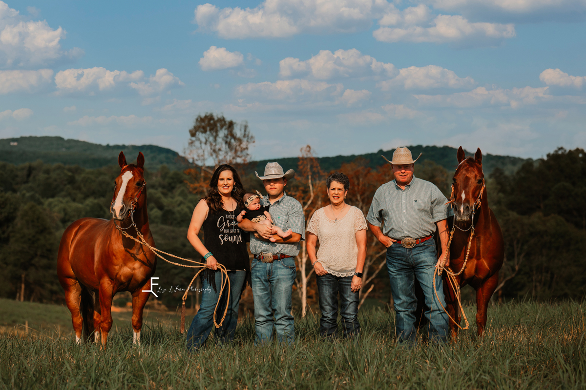 Parents with horses adult children and grandchild