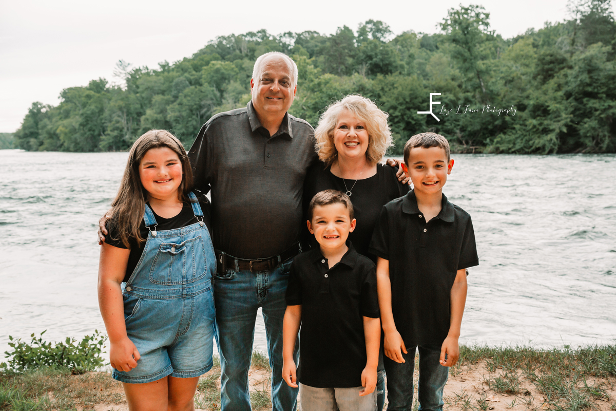 Grandparents with Grandkids on river bank