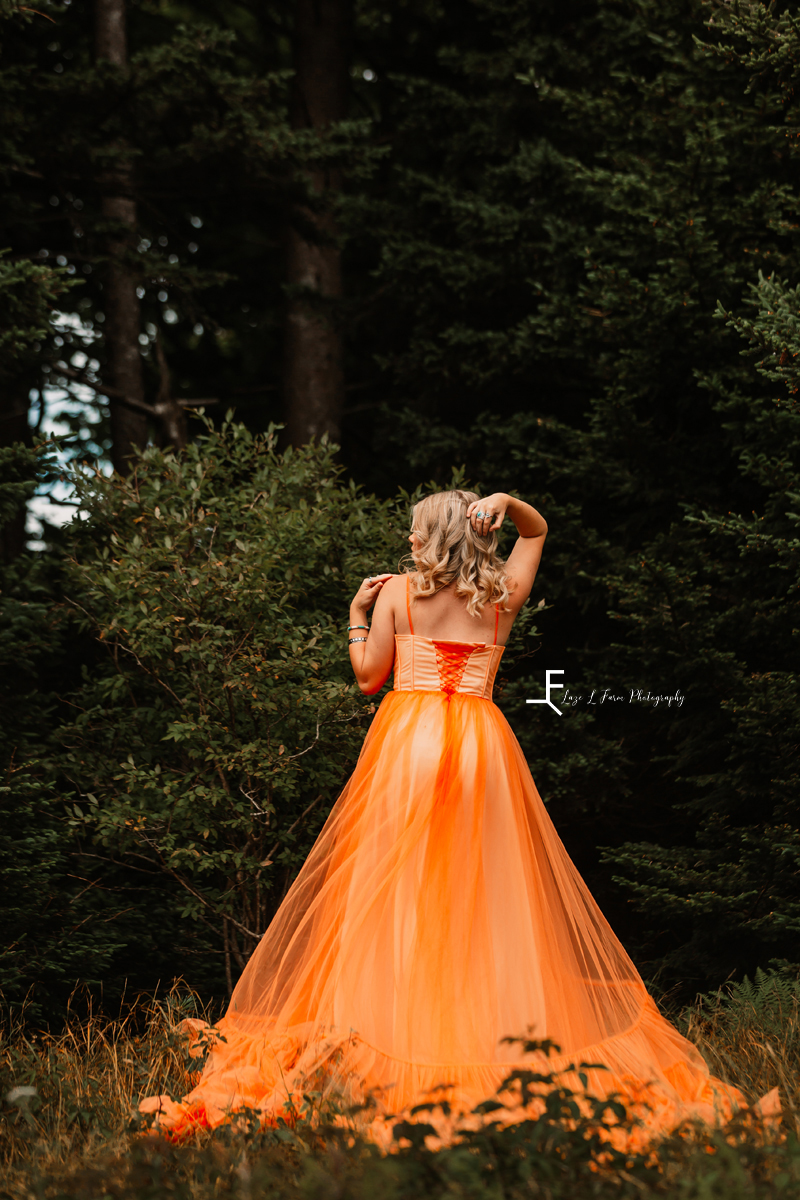 girl in orange dress from behind