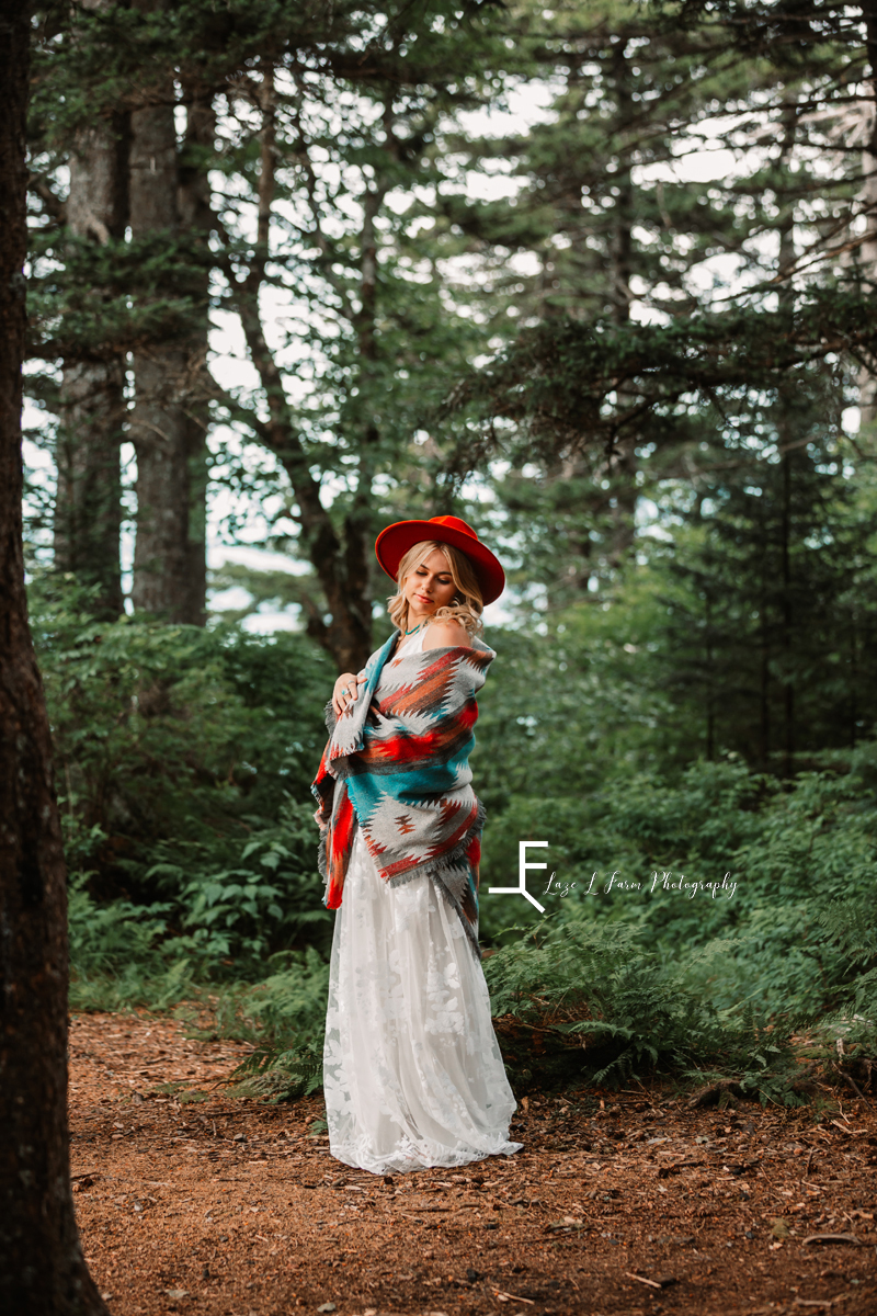 girl in white dress with red hat and blue/white/red wrap 