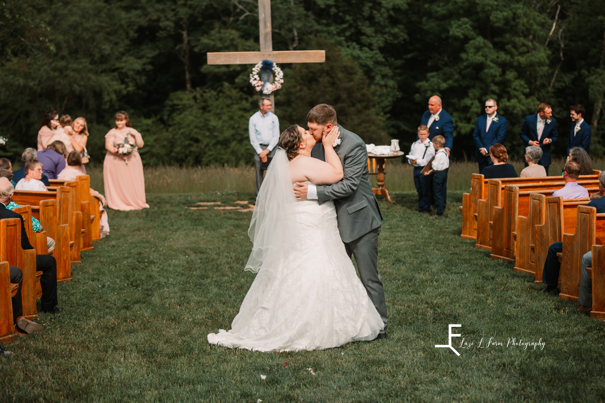 Laze L Farm Photography | Spring Wedding | Amity Creek Farms - Dudley Shoals NC | kissing the bride