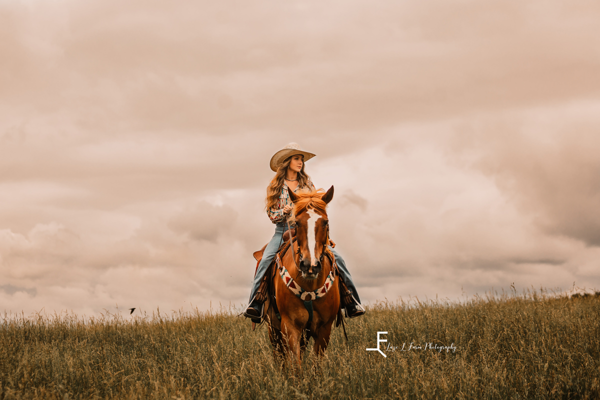 Laze L Farm Photography | Western Lifestyle | Taylorsville NC | girl riding horse with clouds background