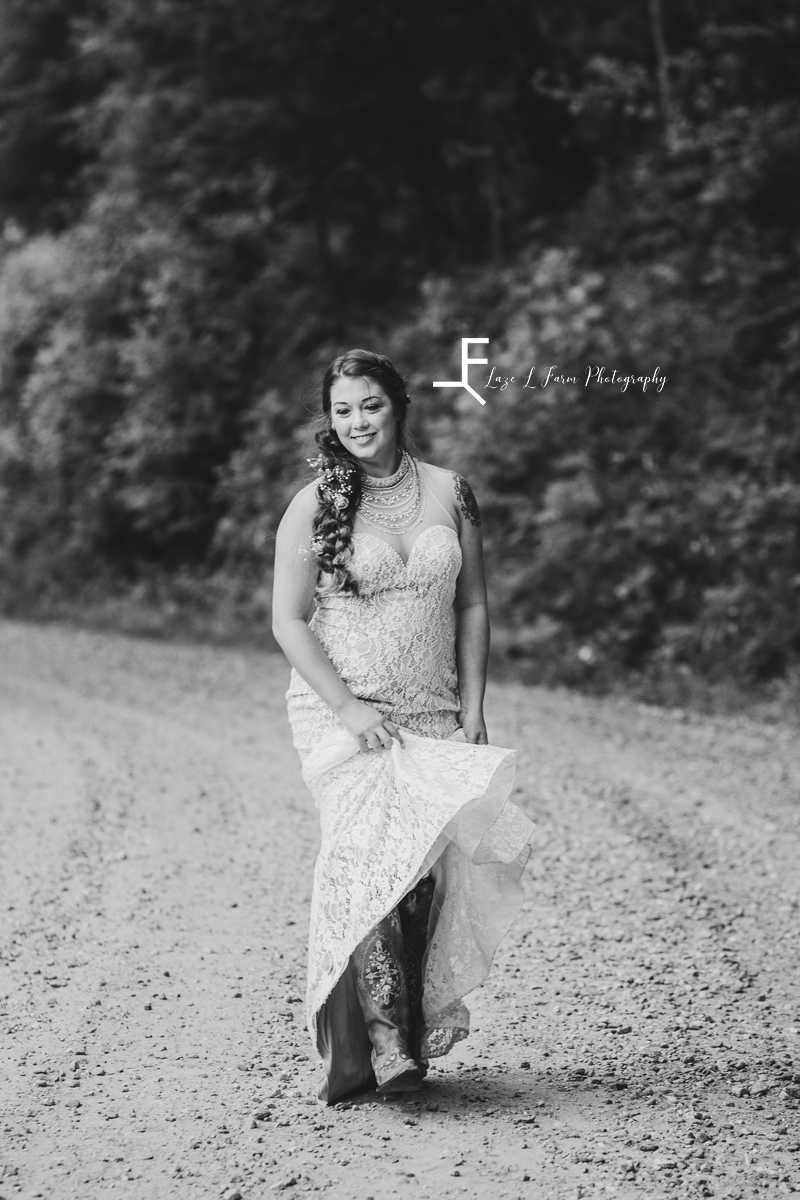 bride twirling in dress in black and white
