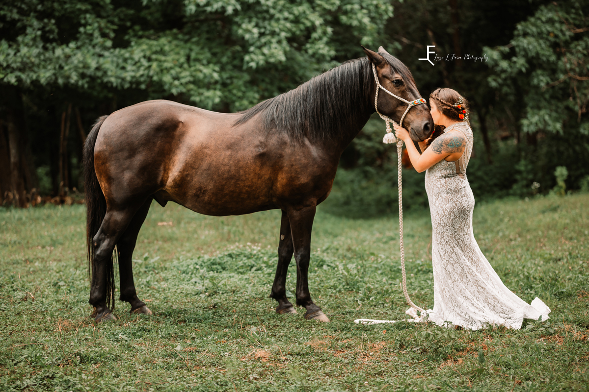 bride kissing black horse 