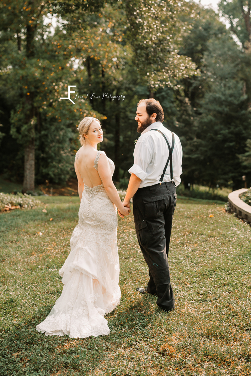 groom with bride looking over her shoulder