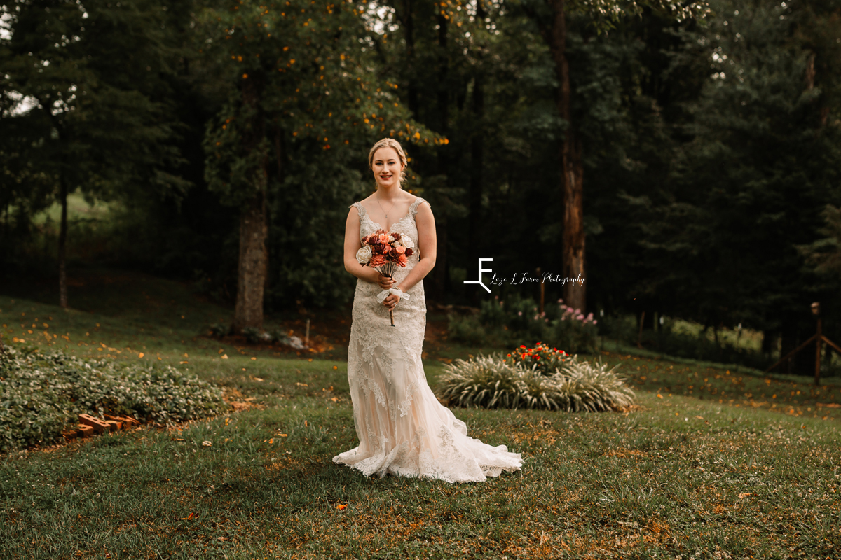 bride holding bouquet full dress 