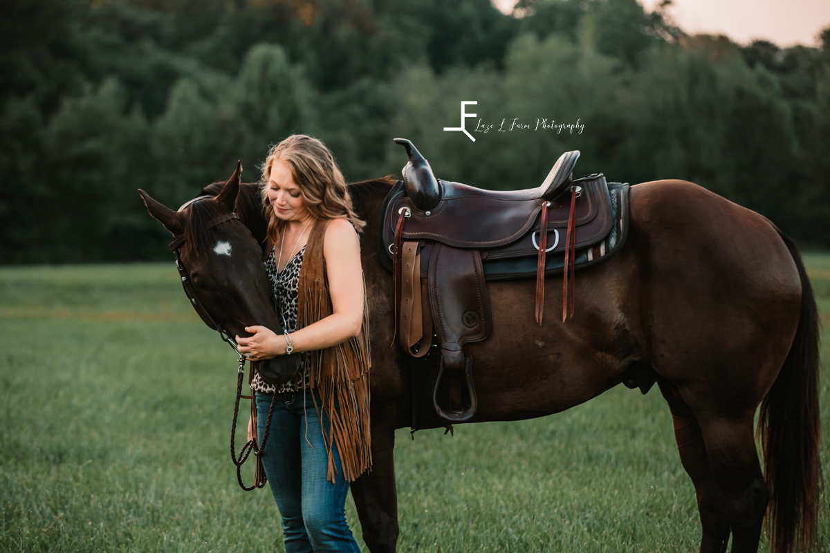 girl in vest loving horse