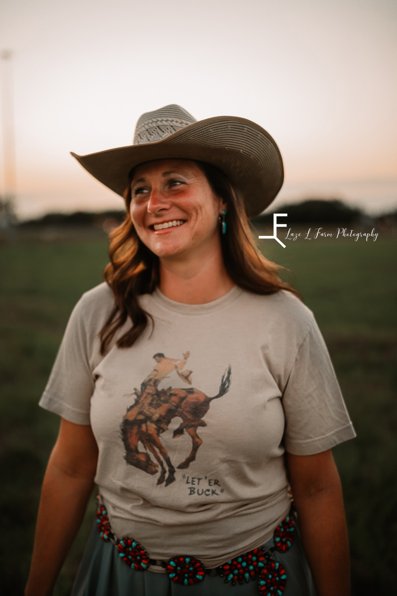 lady in bronco shirt in cowboy hat
