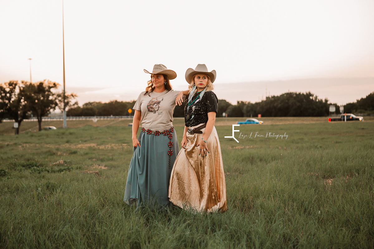 2 women in western clothes standing