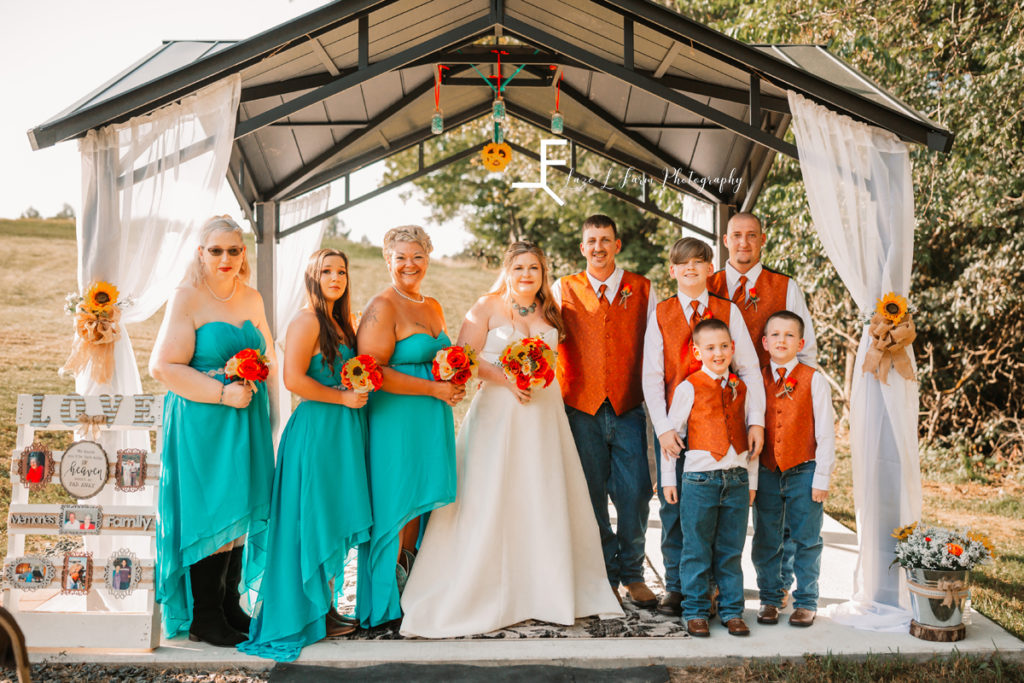 bridal party in teal and orange