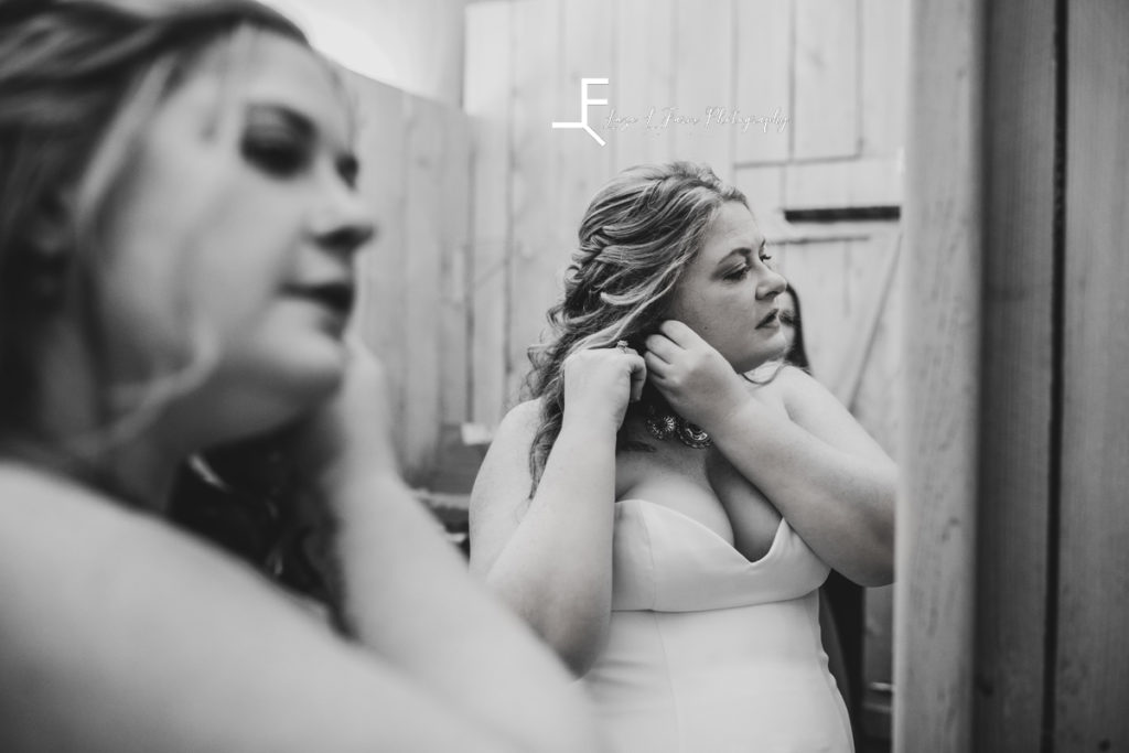 bride getting ready in black and white