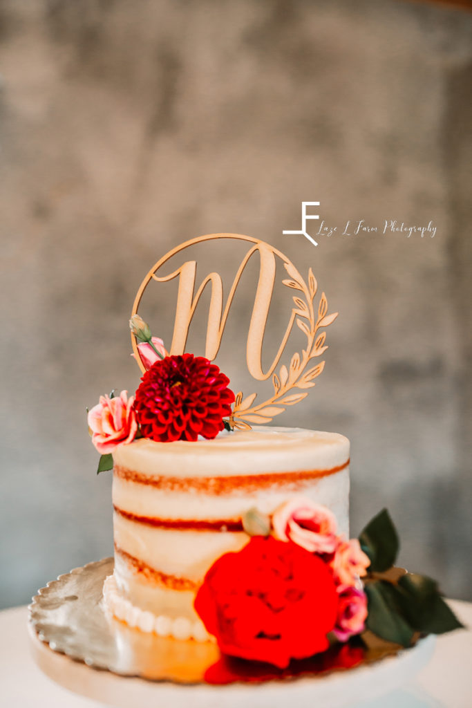 naked cake with M topper