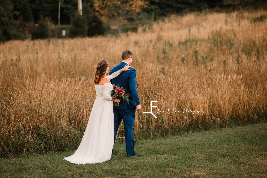 bride tapping groom on shoulder