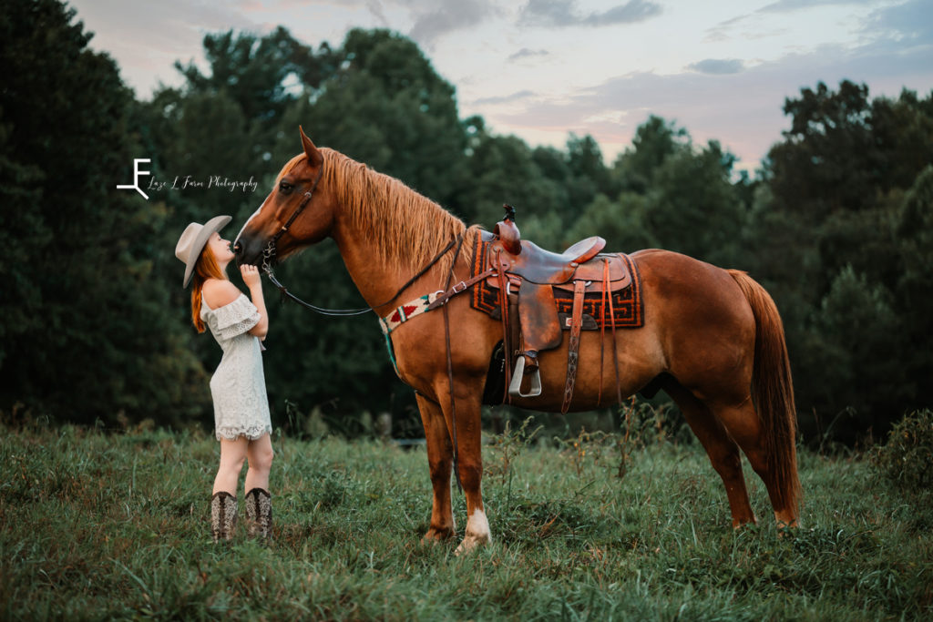 cowgirl in white dress with horse