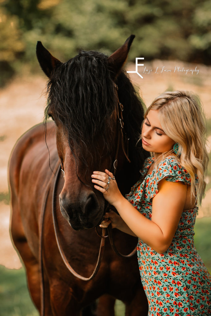 girl loving and looking at horse