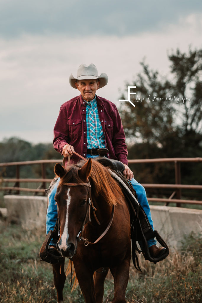 older cowboy with his horse