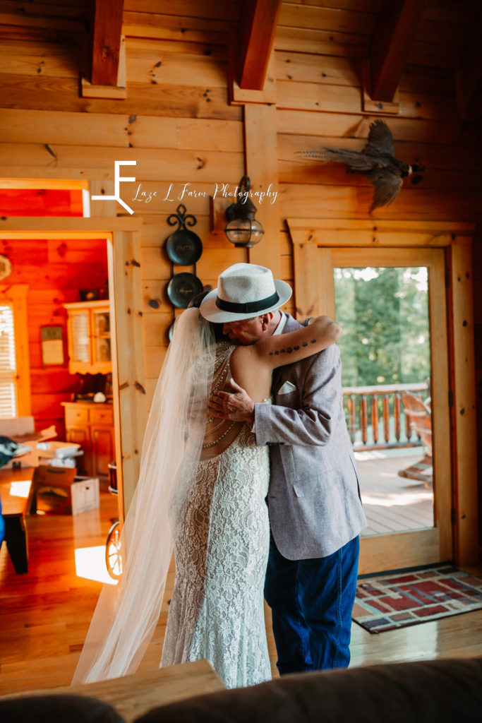 bride hugging dad