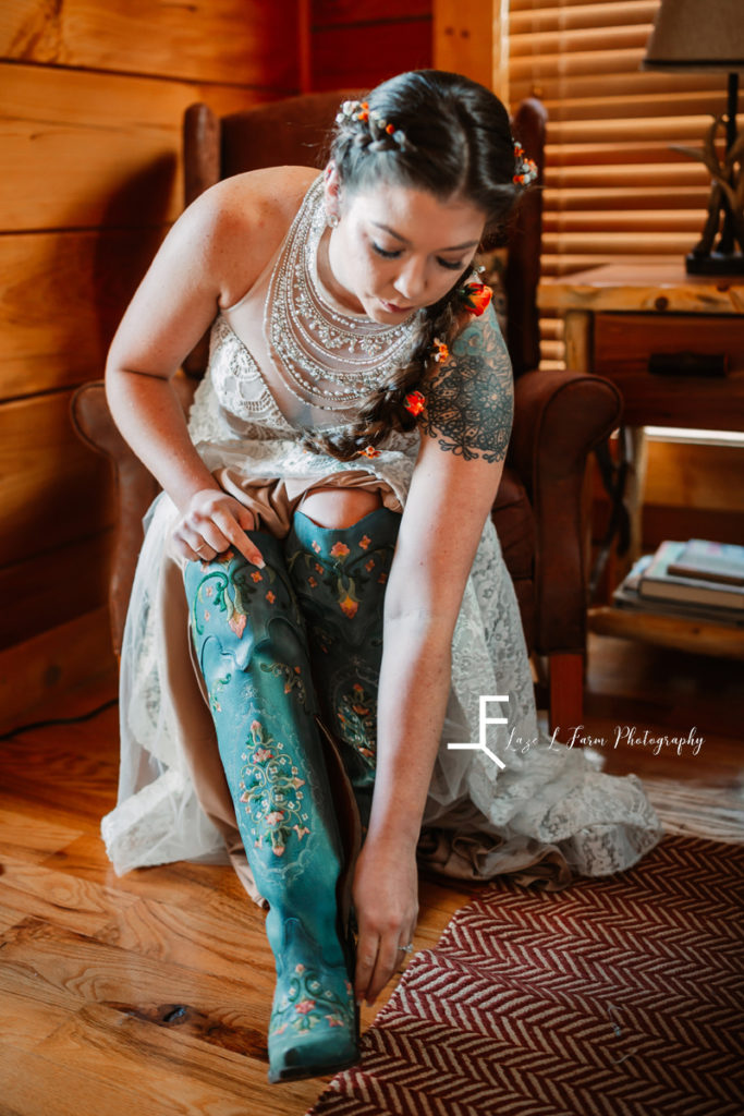 bride putting on turquoise boots