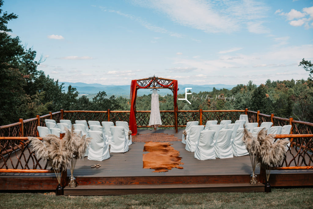 ceremony space with dress hanging infront of mountains
