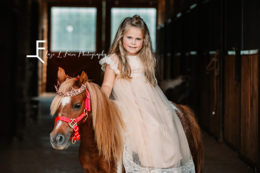 princess riding pony with crown