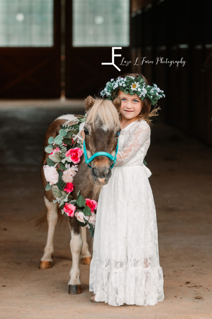 princess with pony with flower crown and flower wreath