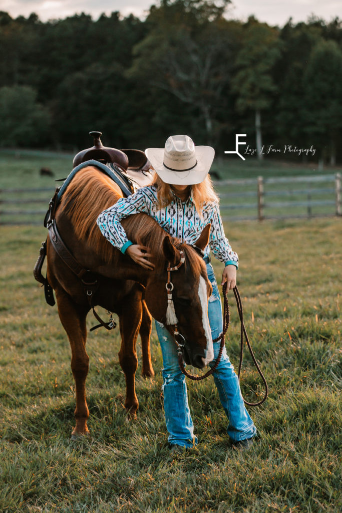 cowgirl loving horse
