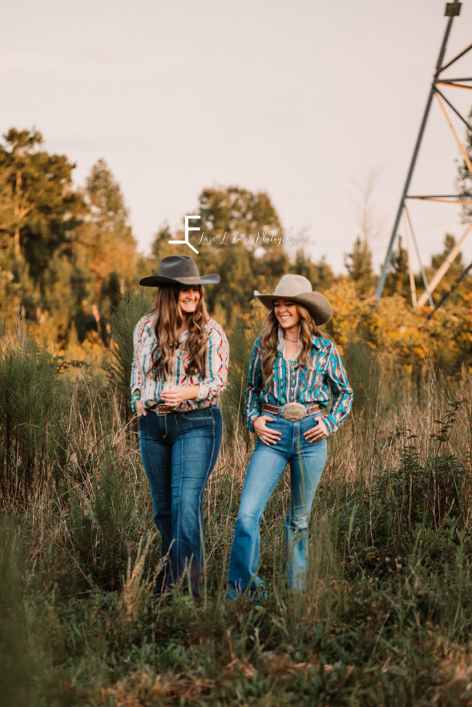 two cowgirls laughing
