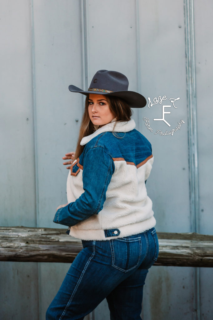 cowgirl in blue and cream jacket