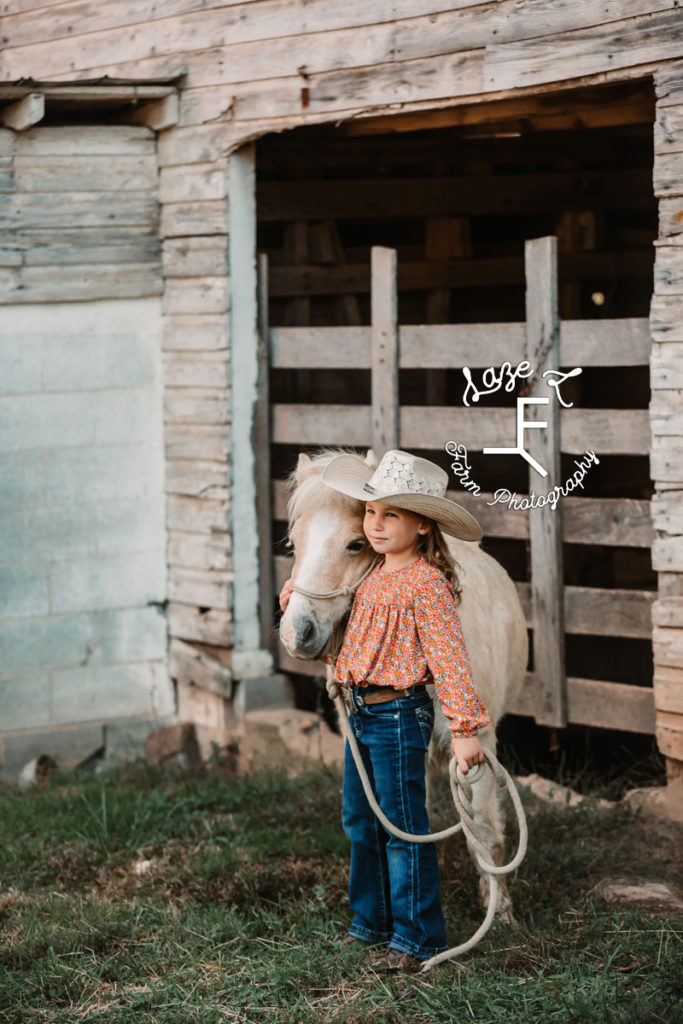 little cowgirl with her pony