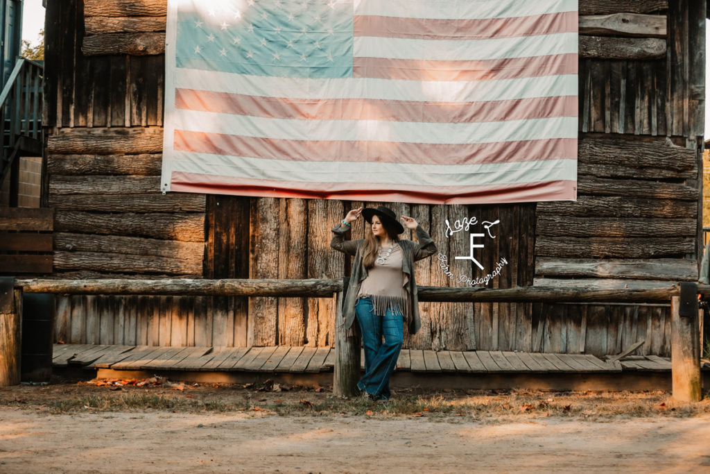 cowgirl with big American flag