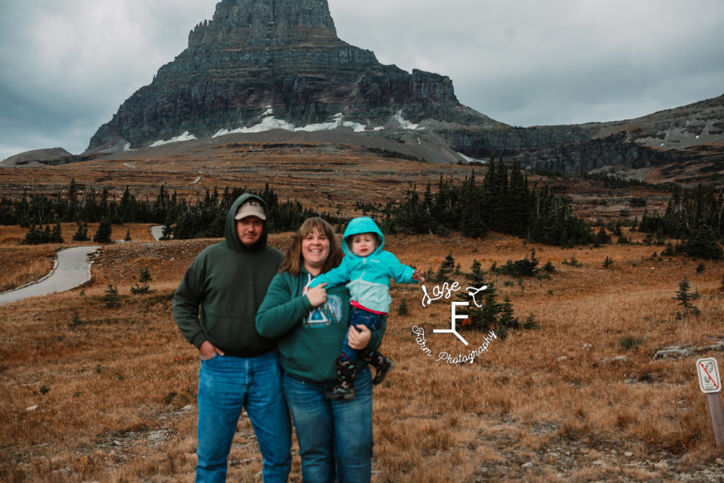sarah, husband and child in front of glacier