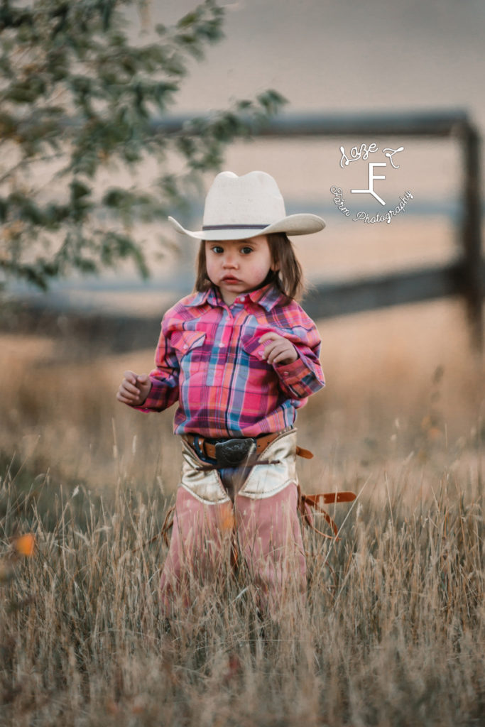 Little cowgirl in pink chaps