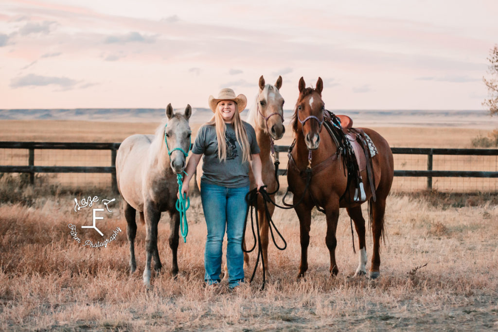 blonde cowgirl with all 3 of her horses