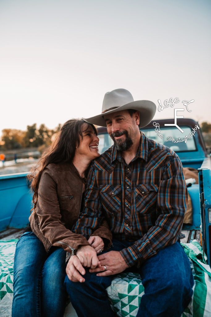 cowboy with his wife in the back of a truck
